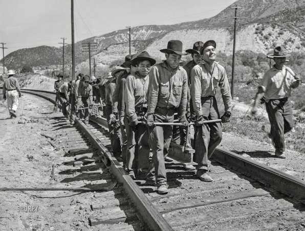 Photo showing: Section Gang -- March 1943. Cajon, California. Indian section gang working on the Santa Fe Railroad track.