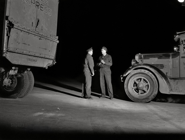 Photo showing: Convo -- February 1943. Truckers talking outside a diner on U.S. Highway 40 in Delaware.