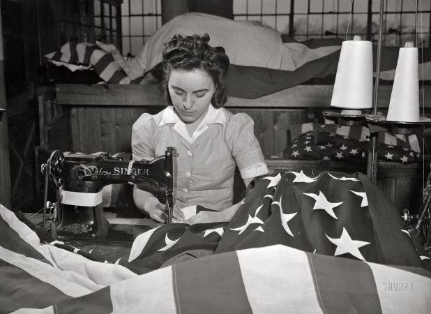 Photo showing: Star-Spangled -- March 1943. Verona, New Jersey. Sewing the edge of an American flag at the Annin Flag Company.