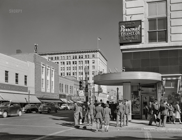 Photo showing: 66 + 85: 1943 -- February 1943. Albuquerque, New Mexico. Stores on West Central Avenue.