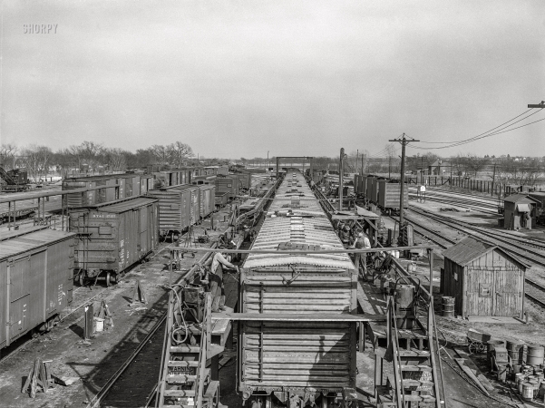 Photo showing: Boxcar Builders -- March 1943. Topeka, Kansas. Part of the Atchison, Topeka and Santa Fe car building shops.