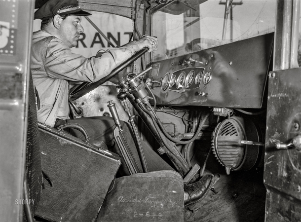 Photo showing: Truckster -- March 1943. Bob Daugherty, a driver for Associated Transport, at the wheel of a Brown truck near Culpeper, Virginia.