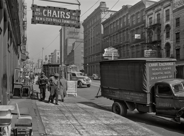 Photo showing: Chair Exchange -- March 1943. Baltimore, Maryland. Trucks in the wholesale district.