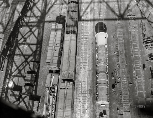 Photo showing: From Above -- April 1943. Detroit, Michigan. Freight cars in railyard seen from above.