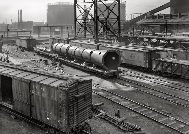 Photo showing: Huge: 1943 -- April 1943. Detroit, Michigan. A huge pipe section loaded on a flatcar.