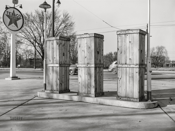 Photo showing: Texacoffins -- April 1943. Detroit, Michigan. Boarded-up pumps at a closed gas station.