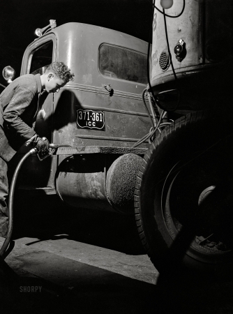 Photo showing: Night Rider. -- March 1943. Evergreen, Alabama -- refueling a Montgomery-to-Mobile truck at 3 a.m.