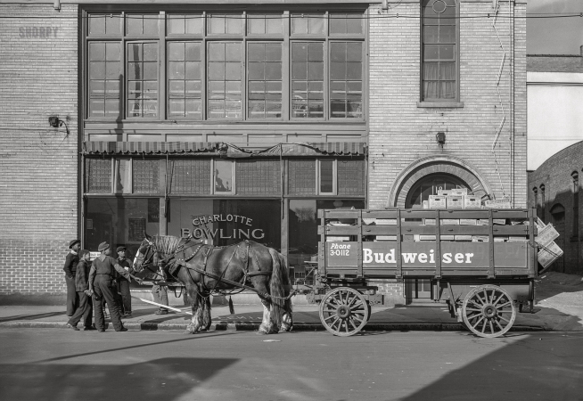 Photo showing: Bowling and Bud -- March 1943. Charlotte, North Carolina. Beer wagon.