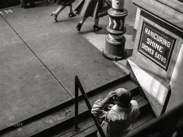 Photo showing: Barber, Bath and Beyond -- March 1943. Lynchburg, Virginia. A barber in front of his shop.