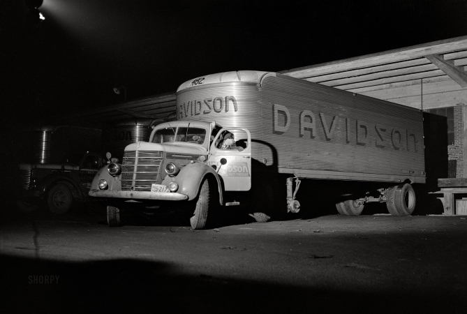 Photo showing: Freight Night -- March 1943. Baltimore, Maryland. Yard jockey backing up a truck
that has just come into the unloading platform at the Davidson truck terminal.